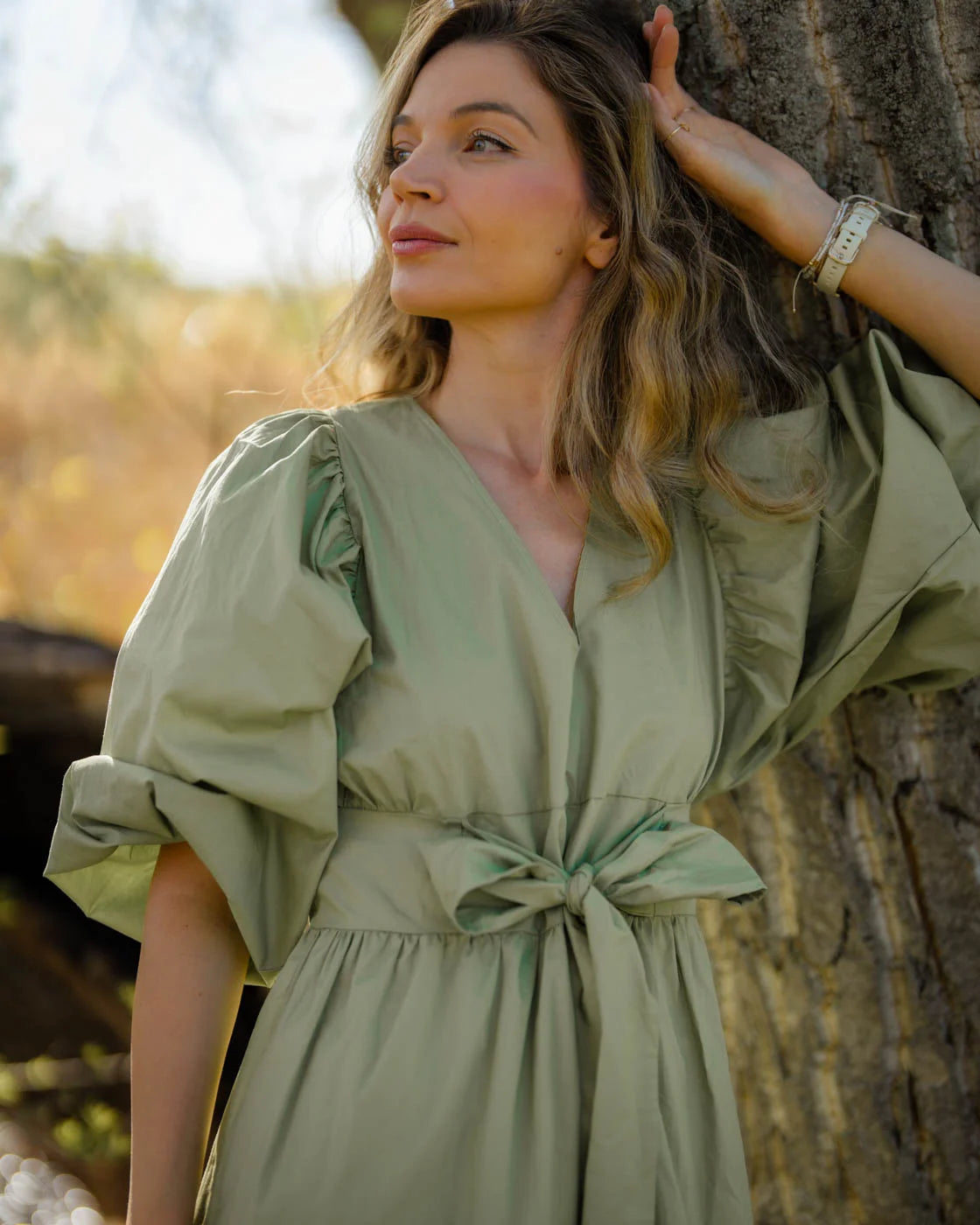 Green dress TROPICANA with a bow